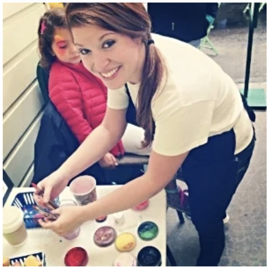 Taylor Wasserman face painting at an event